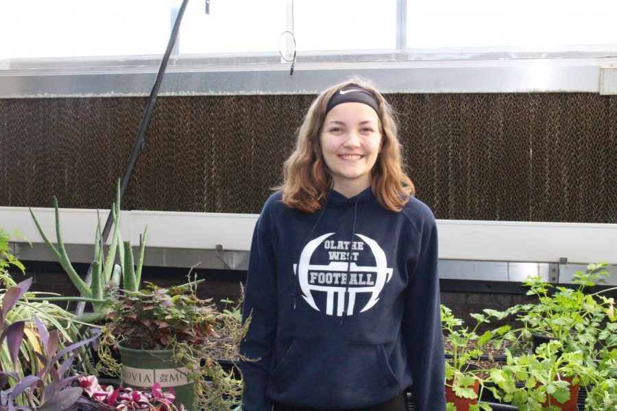 Sophomore Katie O’Keefe appears in Olathe West Green house where her inspiration for the activity was sparked. 