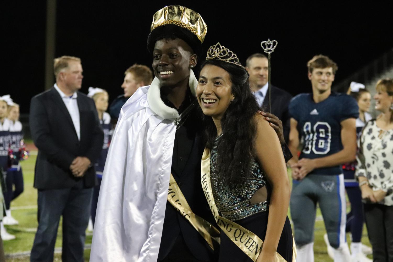 Homecoming King and Queen Austin Curry and Donna Garcia pose for pictures after being crowned.