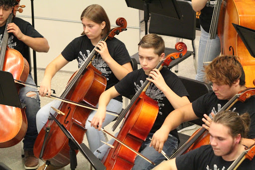 Five cellists, sophomores Ernesto Marquez-Vasquez, Kaitlyn Dewhurst, Aidan Rafols, Legolas Mora, and junior Sam Morss perform with the Concert Orchestra. 