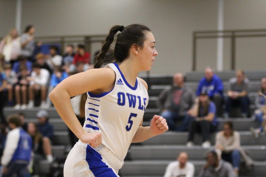 Maddy McGavran runs down the court during the home basketball game on Dec. 13. 