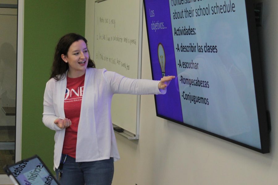 Spanish teacher Anna Nondorf teaches her spanish one class to speak about their classes.