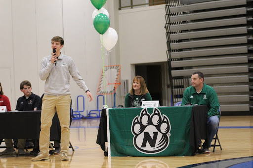 Senior Connor DeLong introduces his mother and father during the spring athletic signing. DeLong signed with Northwest Missouri State University for football.
