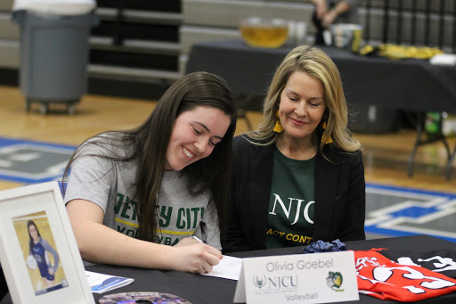 Senior Olivia Goebel signs to play volleyball at New Jersey City University alongside her mother. Her brother, sister and father were also in attendance.