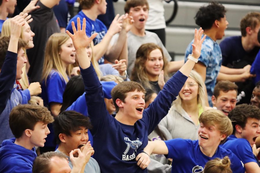 The+student+section+cheers+on+boys+varsity+during+their+senior+night+game+against+Olathe+North.+