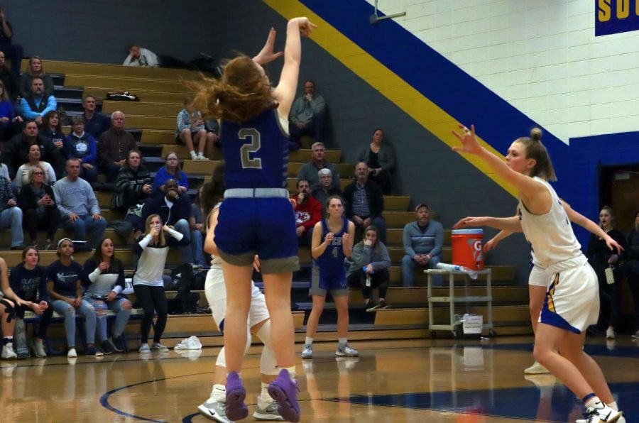Junior Mackenzie Hart scores the last second, game-winning point at the Feb. 21 game against Olathe South.  