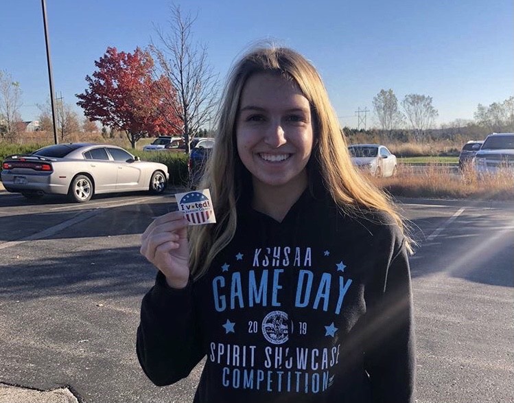 Senior+Haley+Hahn+shows+off+her+%E2%80%98I+voted%E2%80%99+sticker+that+she+earned+on+election+day.+%0A%0A