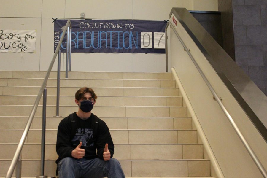 Senior Tyler Burkett sits on the stairs of the Main Entrance during his last week of high school. 