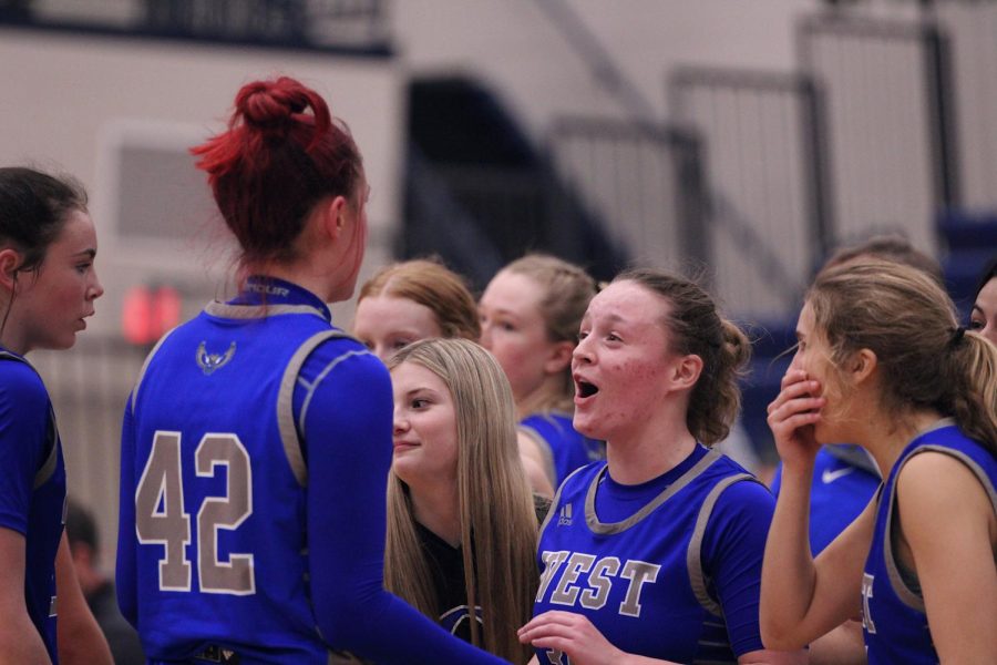 Junior Keely Barnard and Junior Kate Harter celebrate during a time out. Girls basketball defeats Mill Valley with a score of 54-50. The girls varsity team ends January with a 2-3 record.