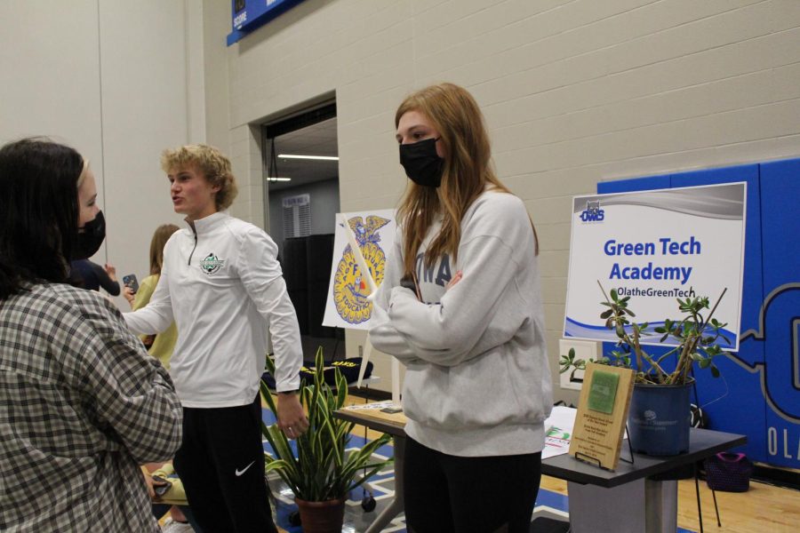 Junior Darby Russell teaches students about what students do in the Green Tech 21st Century Academy.
