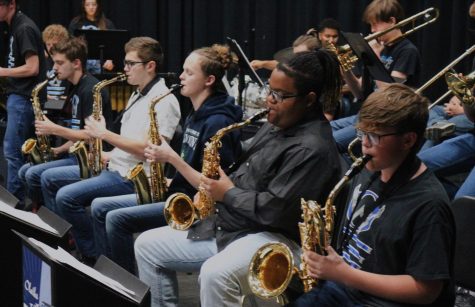 Olathe West Jazz Band performs in the flex theater for parents and students exploring exhibits around the first floor. 
