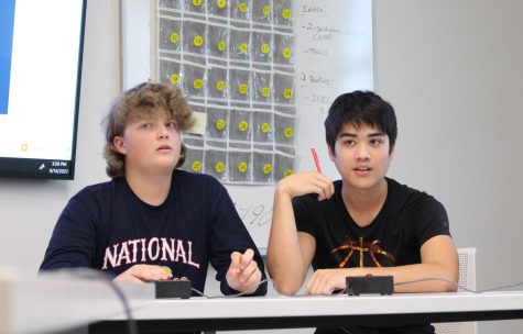 Seniors Jackson Orrick and Cody Slifer compete in a practice round after school on Sept. 16.