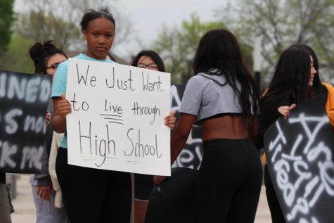 Students protest at Johnson County District Court Office on April 20 about racial discrimination and gun safety led by freshman Teddy Garcia, Olivia Johnson and Delaney Kent.