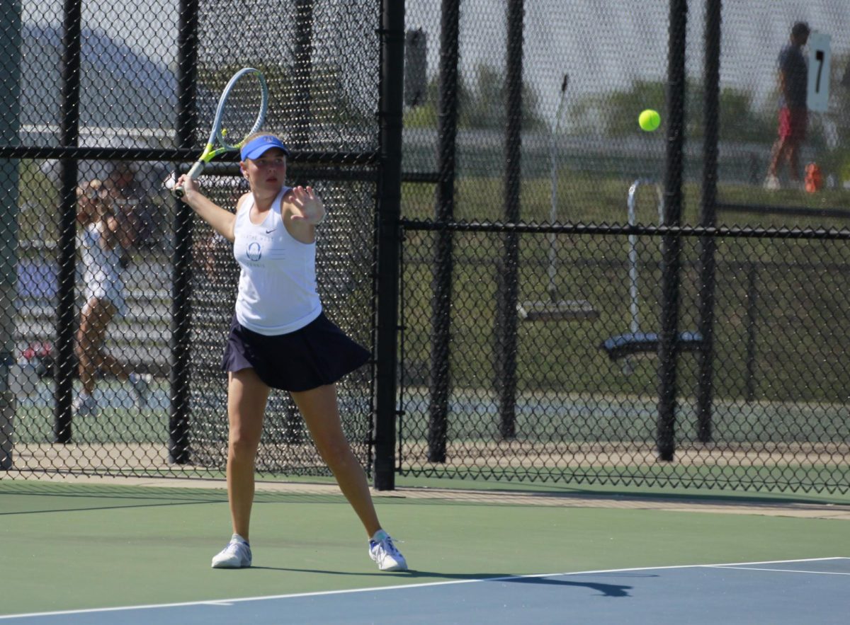 Sophomore Lindsay Ruder competes during her match against Olathe North on September 28th.
