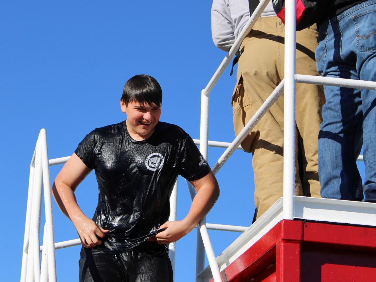 Junior Chase Denton in Public Safety smiles as he exits the cold water from the polar plunge activity.