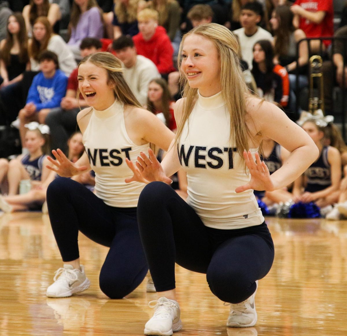Sophomore Reia Wailser junior Kaylei Wiedenmann dance at the winter pep assembly. The dance team preformed their state competition dance. 