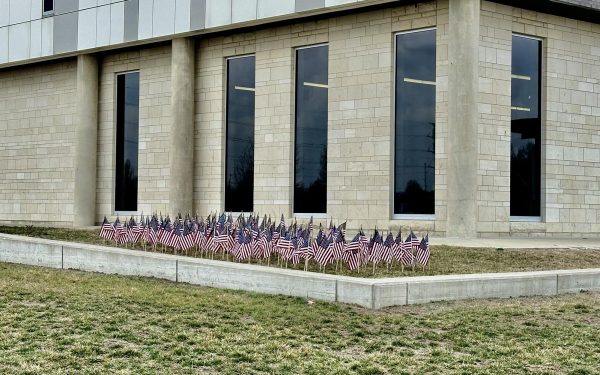 Flags sit outside of the Public Safety Academy classroom in honor of fallen law enforcement members in 2023.