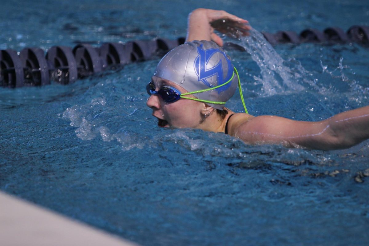 Junior Abigail Rau performs the butterfly.
