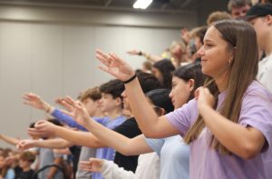 Freshman learn chants during Freshman orientation on the first day of school.