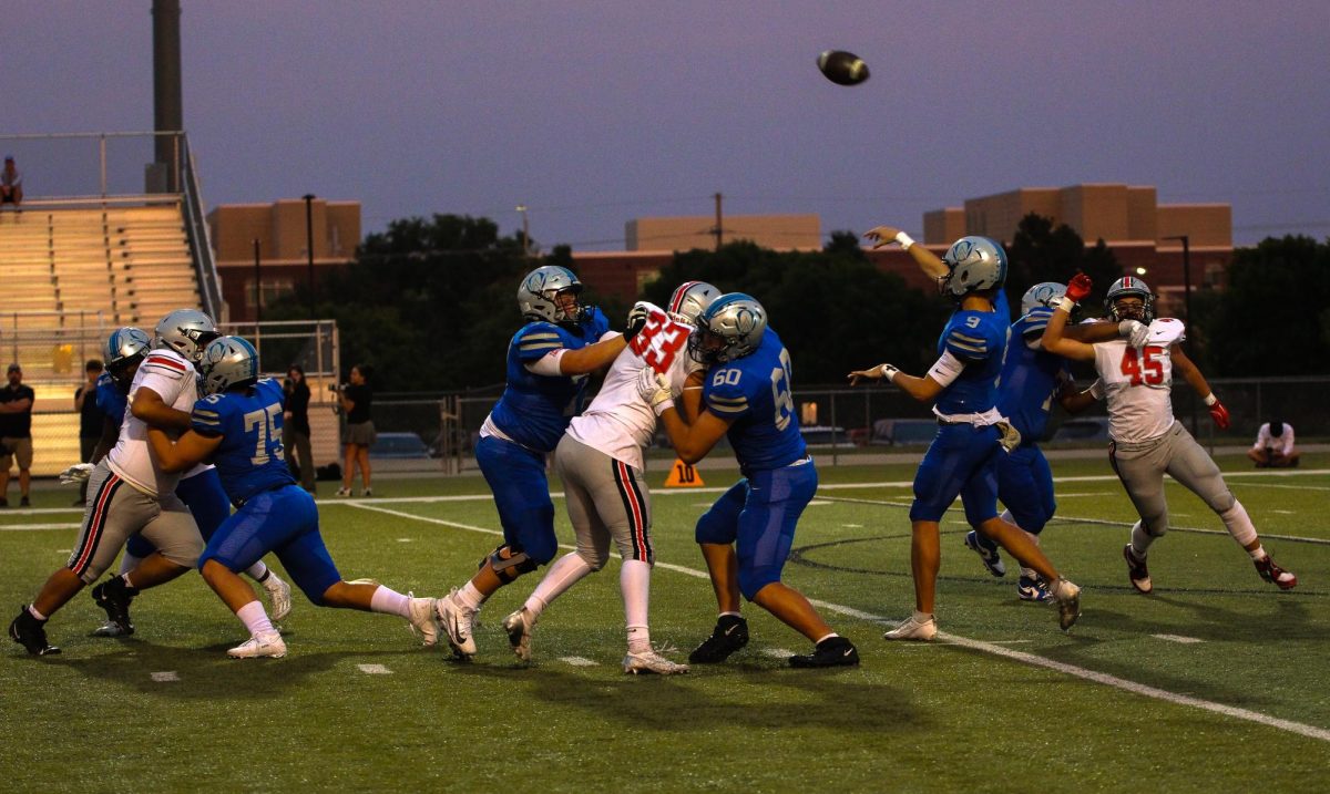 Sophomore Cameron Kruse throws the ball downfield vs Blue Valley West