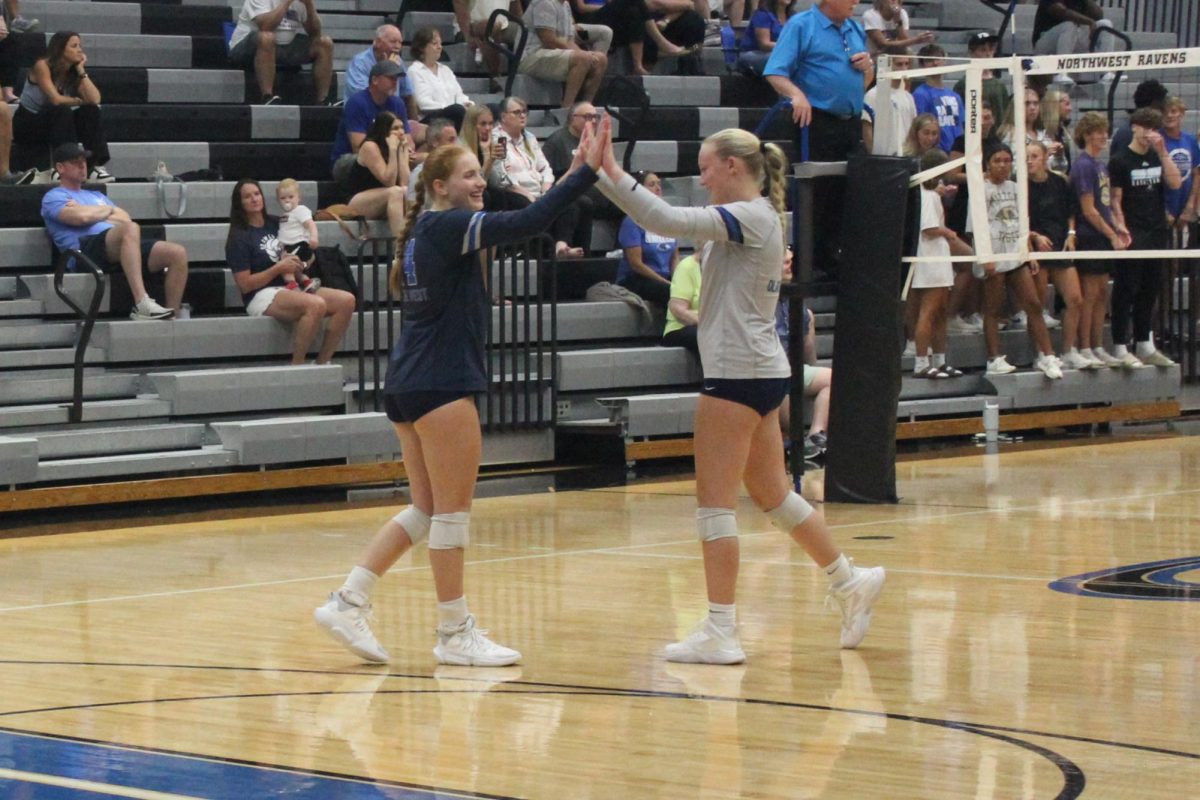 From left senior Ashley Barcus and Ava Johnson celebrating during a match