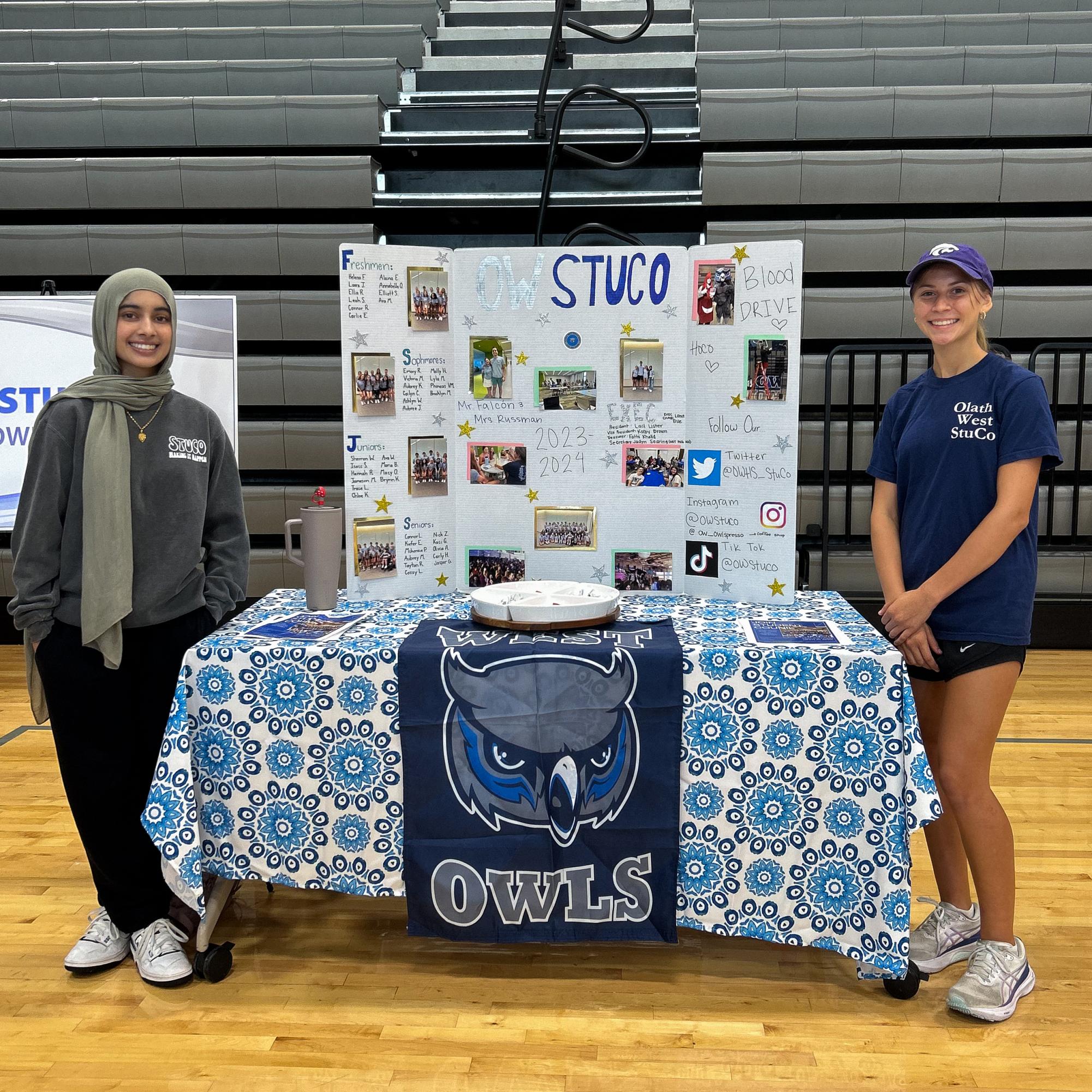 From Left senior Fatima Khalid and freshman Taylor Heidari next to their table at the activity fair.