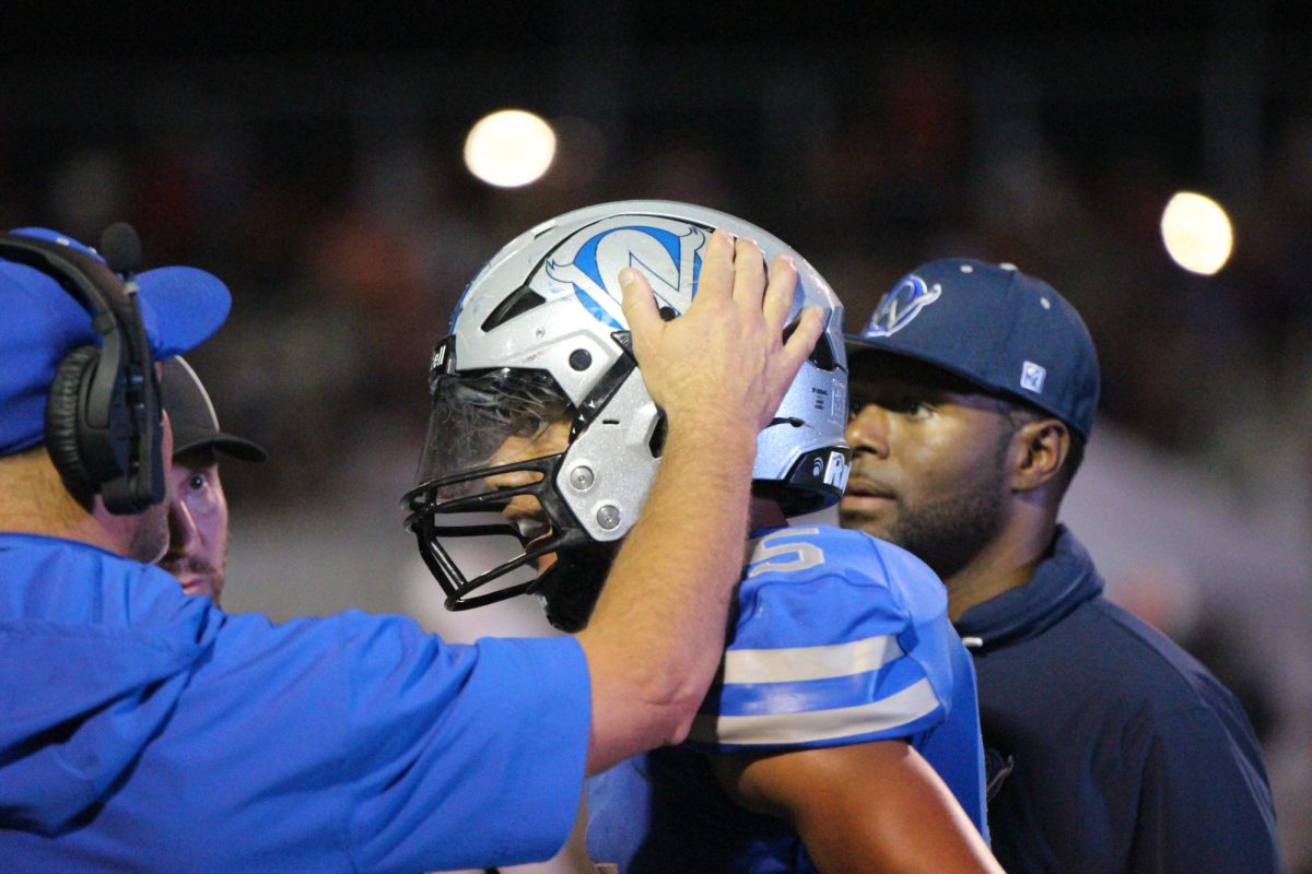 Senior James Dorsey gets encouragement from coach Mike Zegunis