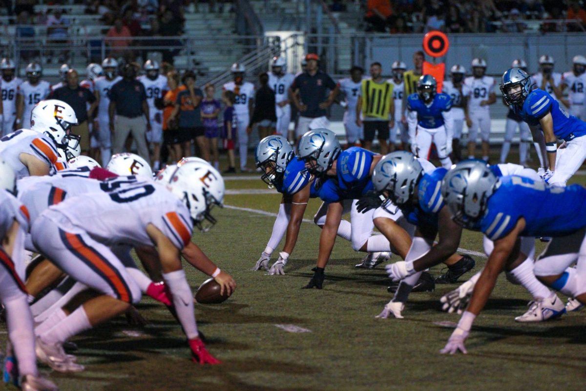 The Owl Defense lines up against Olathe East