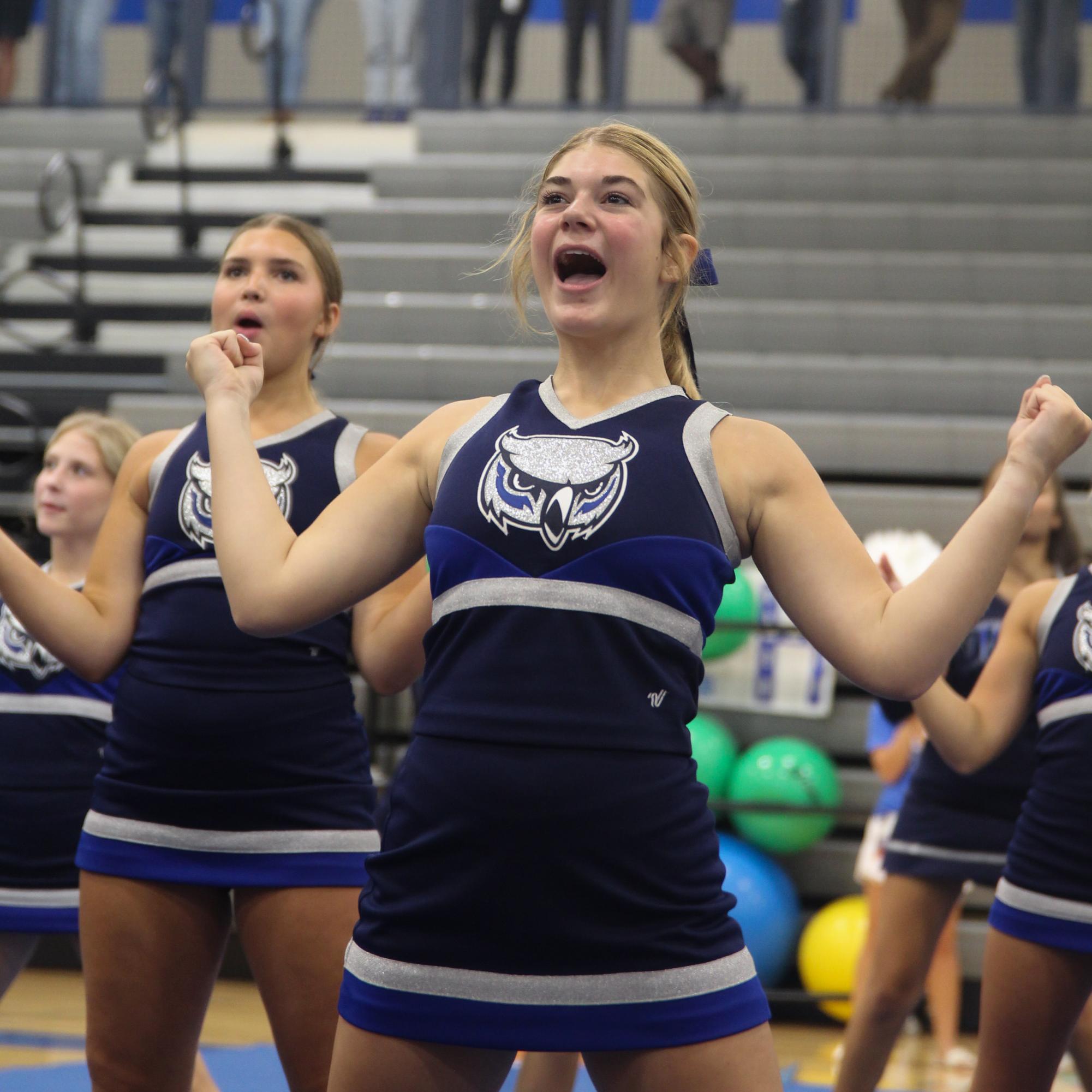 From left sophomores Learah Heinen and Carlie Ernest preform their cheer routine at freshman orientation