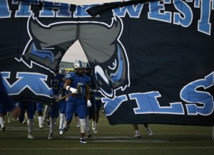 The Owls take the field at the Homecoming football game.