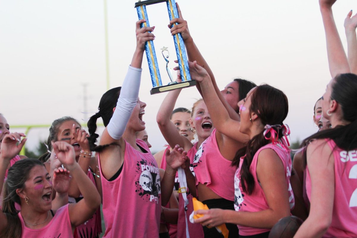 Seniors jump with joy after winning the Powder Puff game on Oct. 2