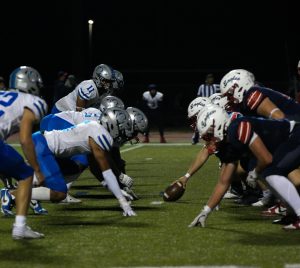 The Owls' defense lines up against the Olathe North offense