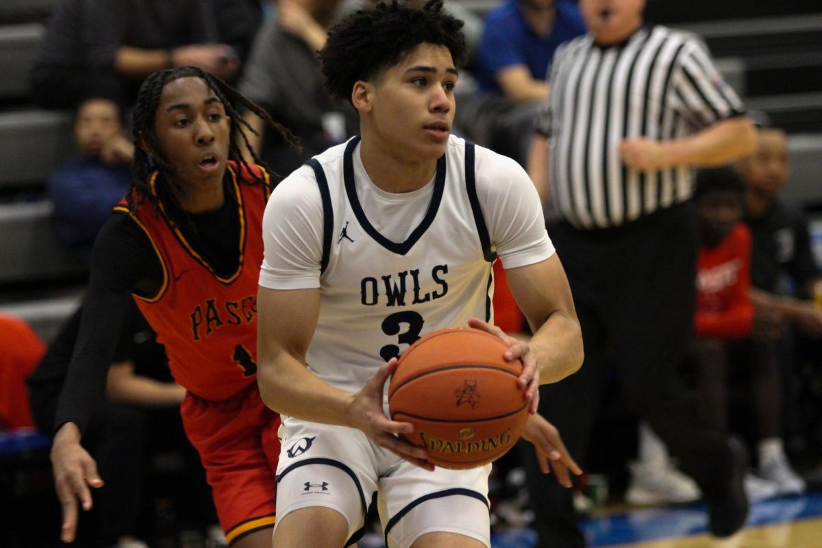 Senior Sherron Woodbury drives to the basket against Paseo Academy