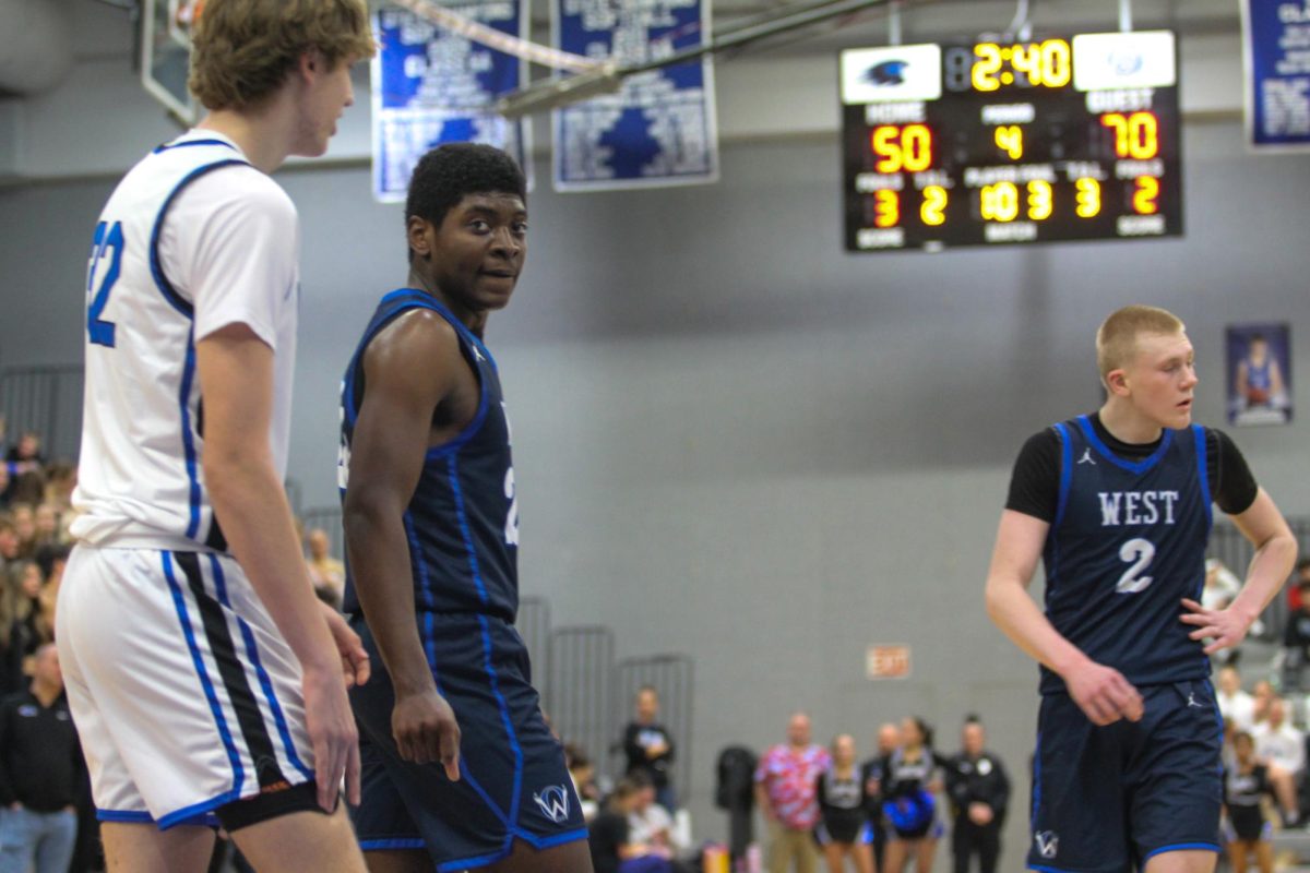 Junior David Harper gets ready to play defense against Olathe Northwest