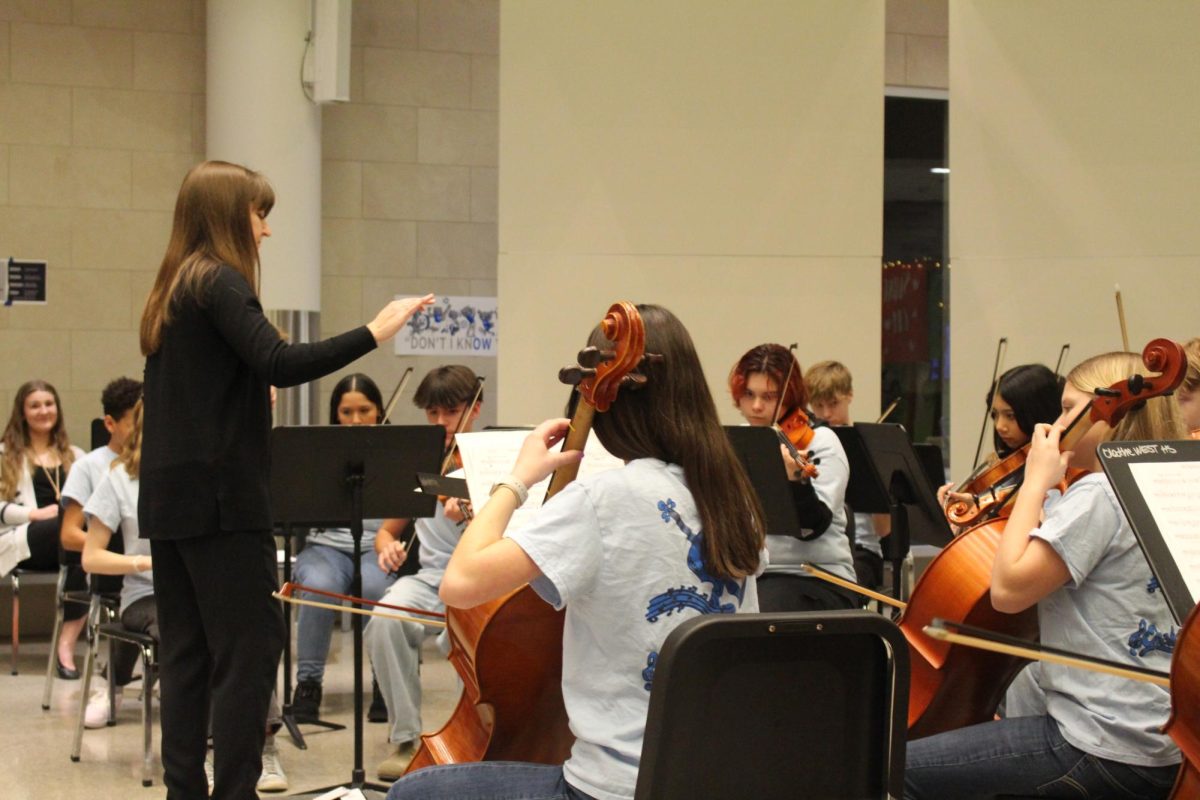 Assistant Orchestra Director Kimberly Michaelis conducts the freshman orchestra.