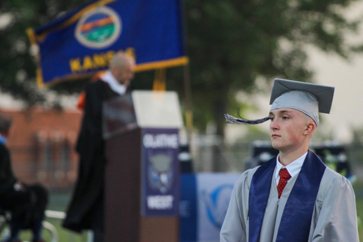 Senior Maxwell Archibald is seen walking towards the stage.