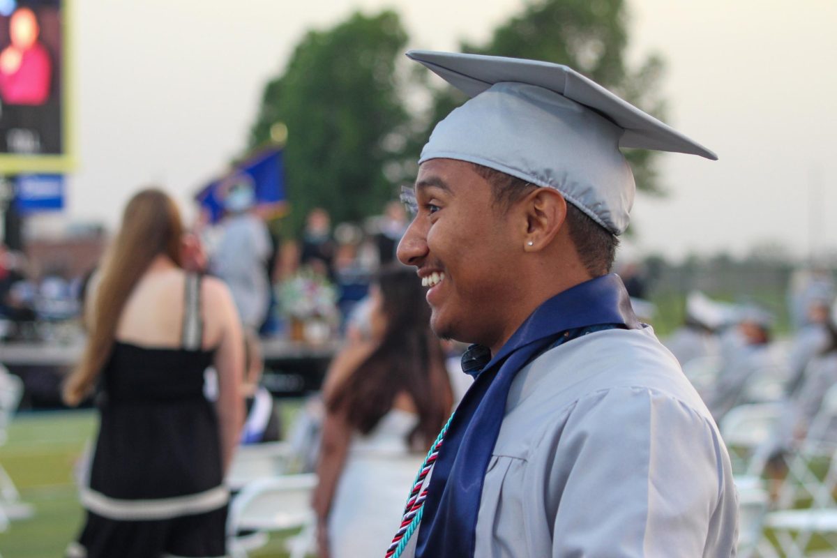 Senior Christian Ferman Almendra is seen chatting with a classmate out of frame. 