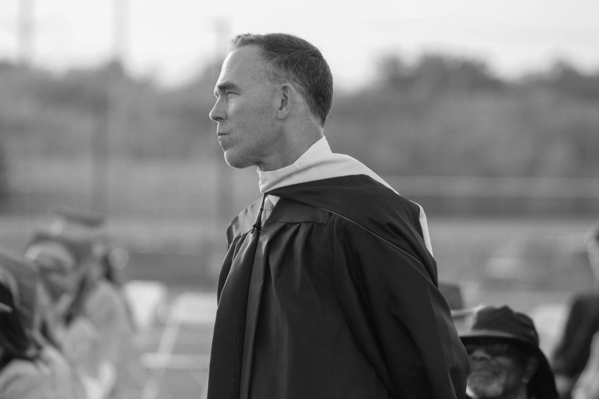 Mike McLaughlin is seen standing and being recognized for his amazing work over the years.