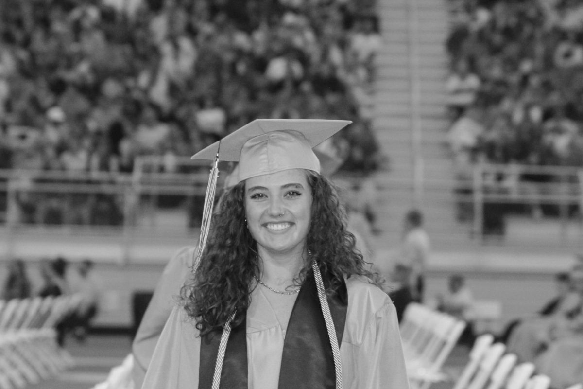 Senior Remyngton Vallad is seen smiling at the camera. 
