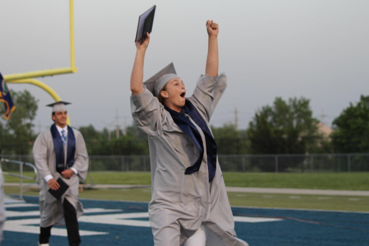 Senior Alyssa McCoy celebrates after receiving her diploma.