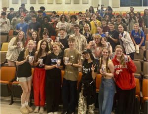 Students pose for a photo with their Purple Dragon drinks and creator Jackie Nguyen during ASU event.