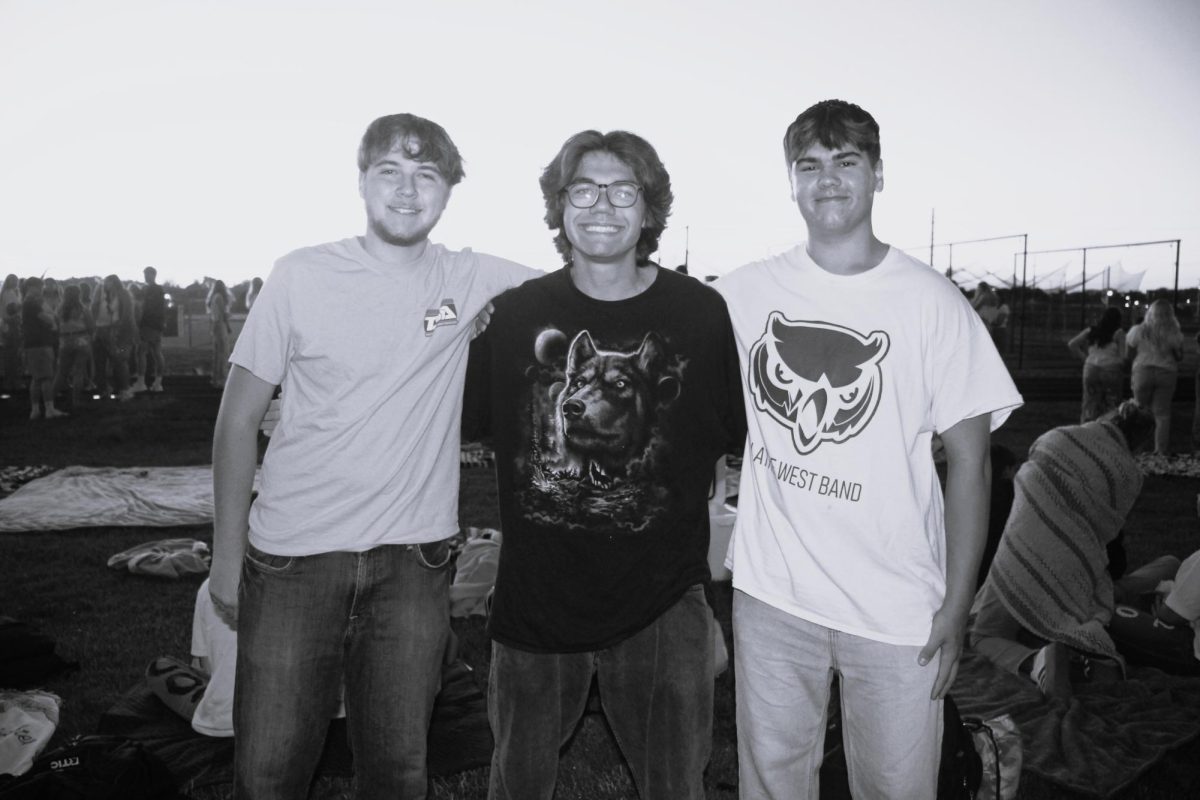 From left, Taylan Parrish, Joel Crum and Owen Twaddel smiling for a group photo.