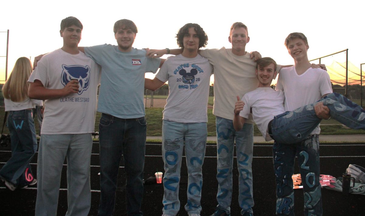 From left, Owen Twaddell, Taylan Parrish, John Shannon, Emerson Schoenthaler, Alex Rippel and Phineas Van Maanen smiling for a group photo.