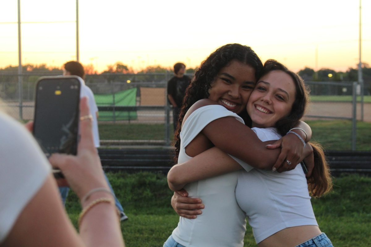 Ilyse Haynes and Allie Farmer hugging for a photo.