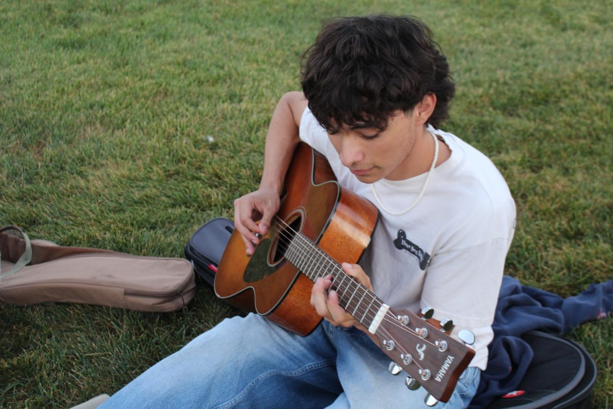 Daniel Reyes playing guitar.