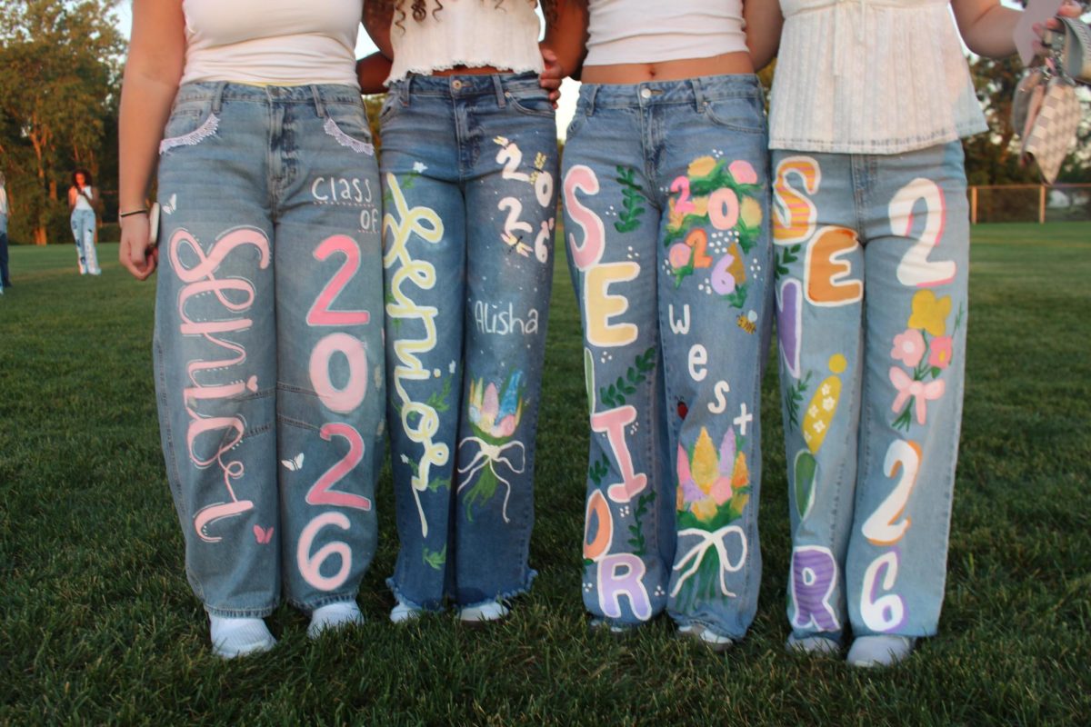Seniors showing off their decorated jeans.