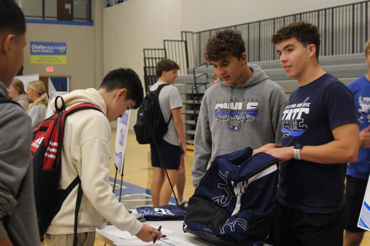 From left Cooper Autstin and Alec Trubiroha working the Swim and Dive booth.