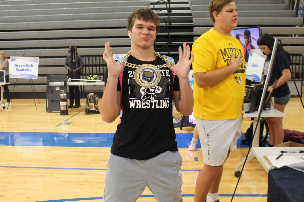 Sam West showing off the boys Wrestling pin chain.