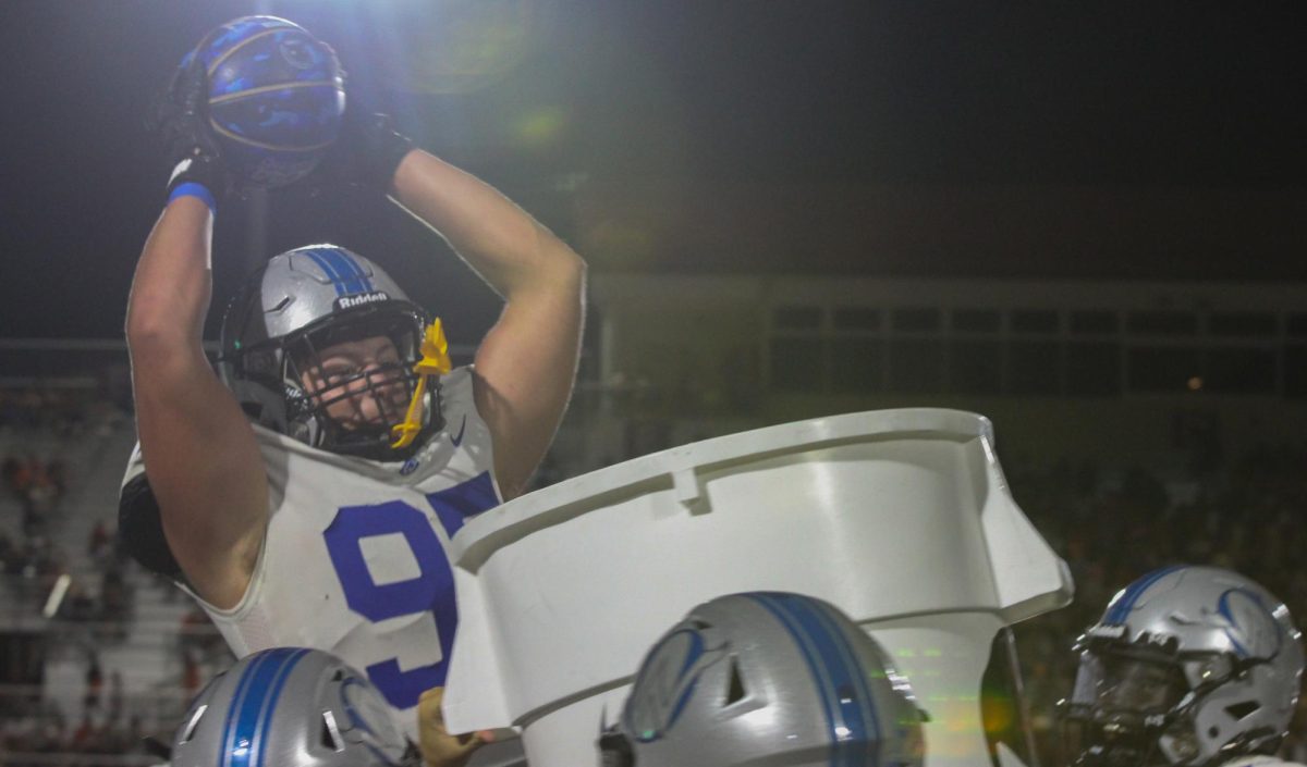 Senior Conner Tracy dunks a basketball after recovering a fumble vs Shawnee Mission Northwest