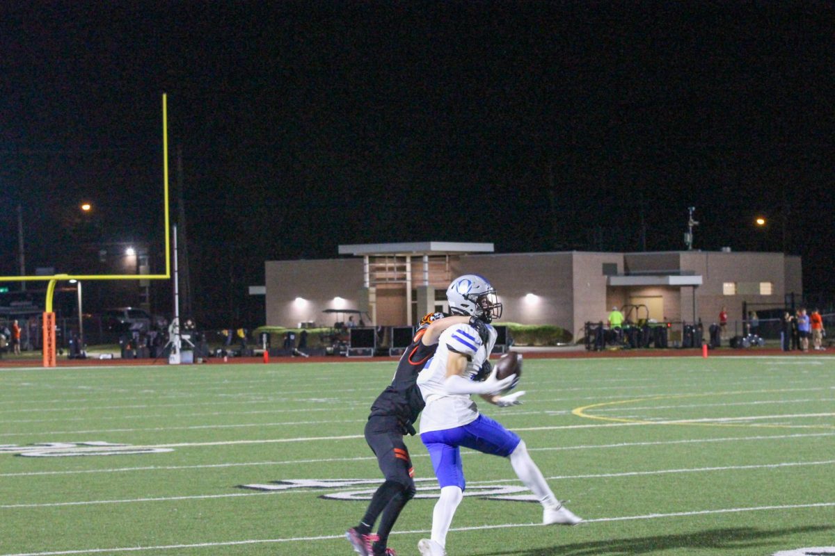 Senior Sam Krzykowski hauls in a pass against Shawnee Mission Northwest