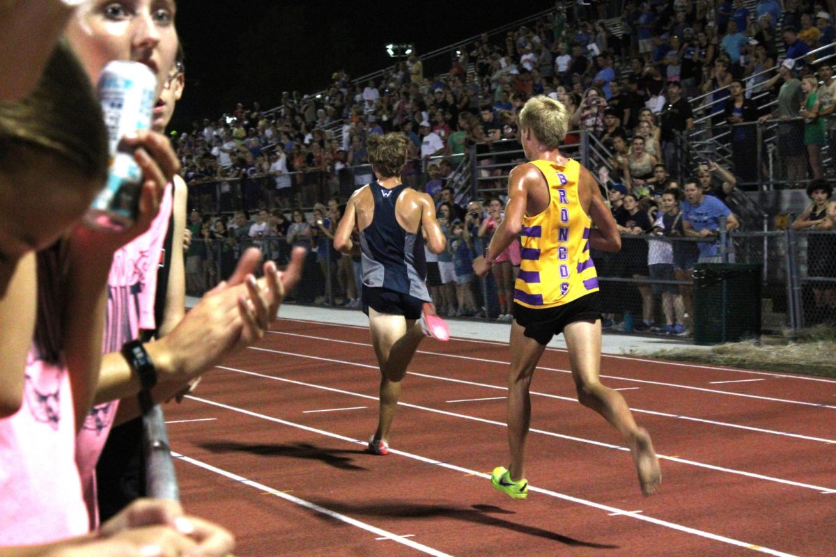 Senior Jace Stoll sprinting to the finish line at the Twilight meet.